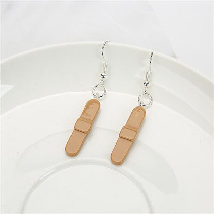 Des boucles d’oreilles en résine pour femmes