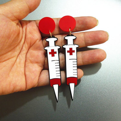 Boucles d'oreilles seringues 