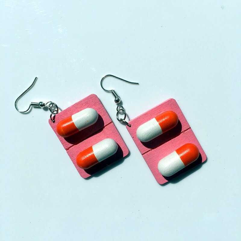 boucles d'oreilles capsules roses